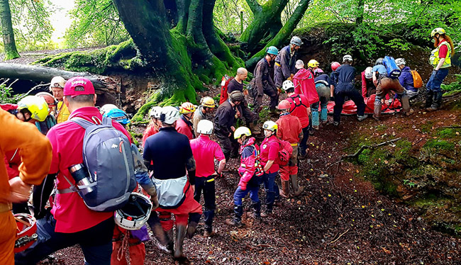 Moving the stretcher across uneven ground