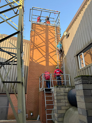 The rigging team climbing the tower